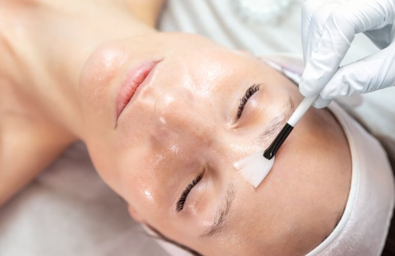 woman getting enzyme peel treatment