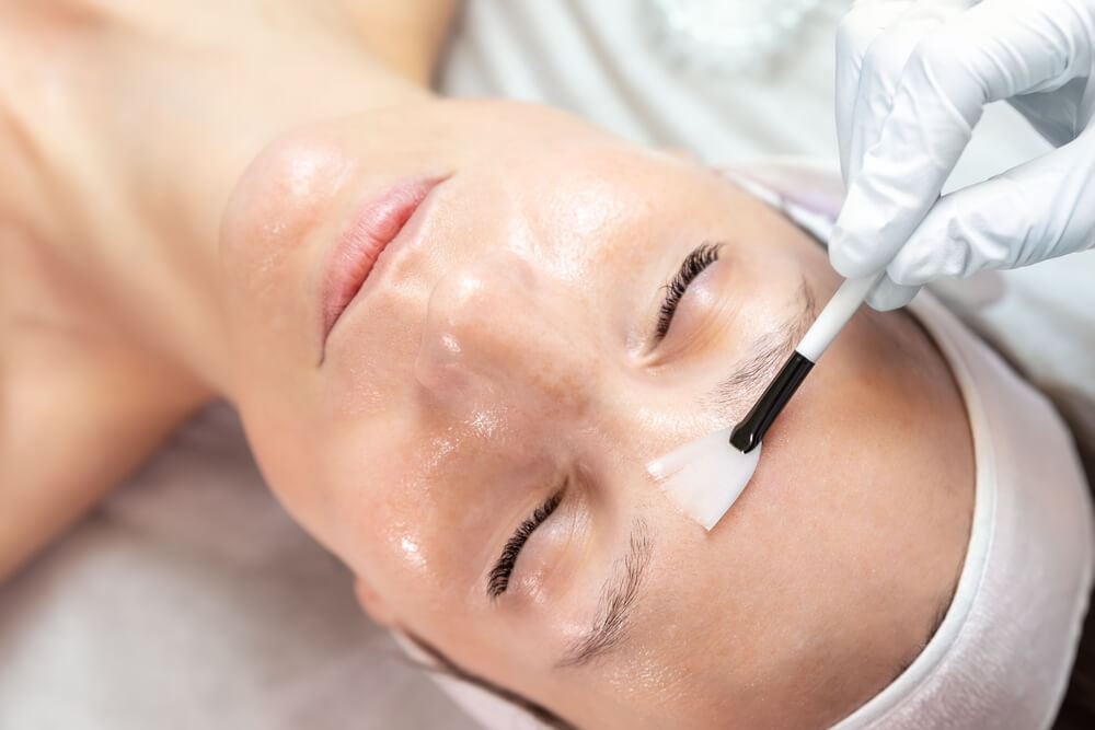 woman getting enzyme peel treatment