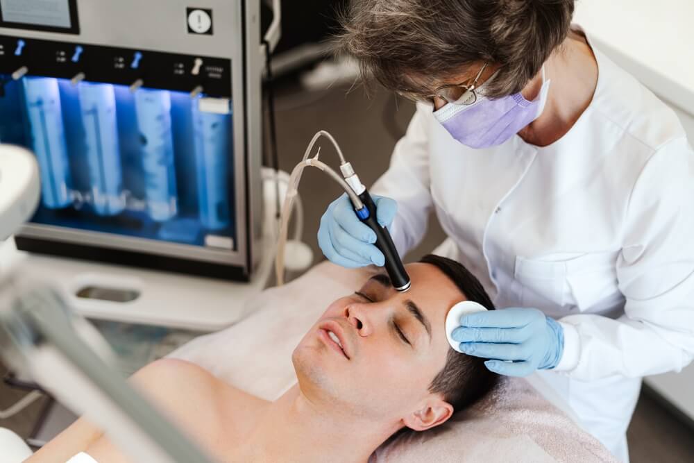 Microdermabrasion facial treats acne by a number of mechanisms: