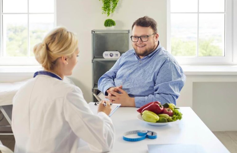 Patient receiving a medical weight loss consultation weight loss clinic