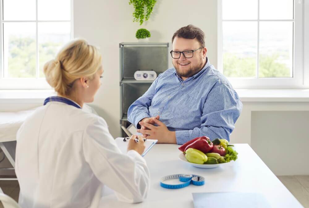 Patient receiving a medical weight loss consultation weight loss clinic