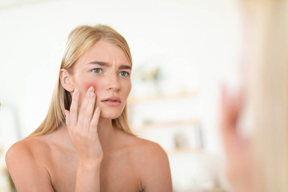 a worried client concerned about acne before blue light therapy