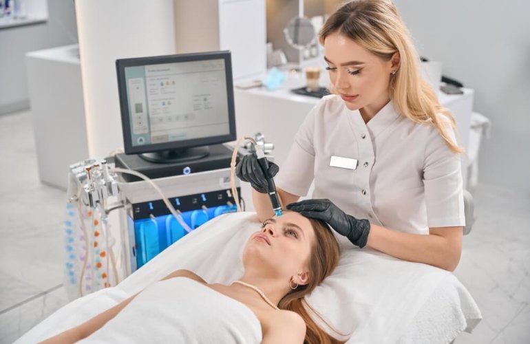 Medical-grade HydraFacial treatment cleansing, exfoliating, and hydrating the skin at a professional medspa