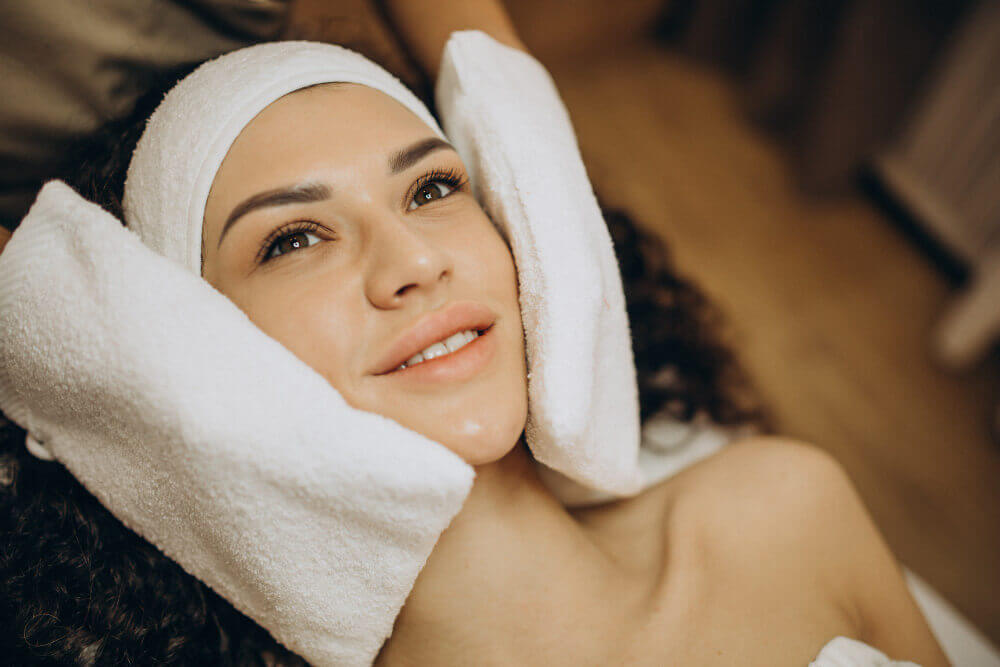 client enjoying a relaxing spa environment during a European facial in Tampa