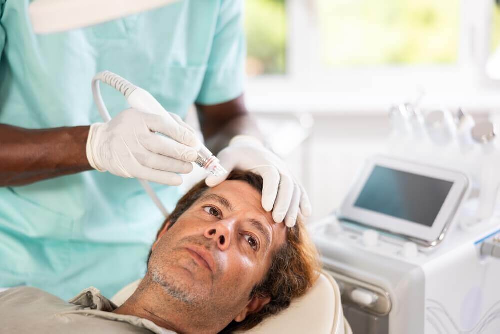 Professional microdermabrasion machine with crystal exfoliation system used for acne scar treatment.