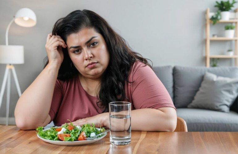Woman worried because of weight gain and looking for bioidentical hormone replacement therapy for weight loss and hormonal balance treatment
