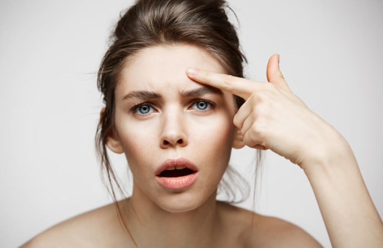 Woman with hooded eyes looking concerned before Botox treatment