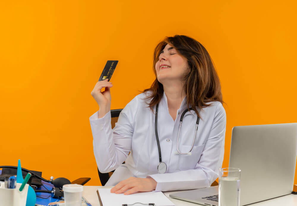woman holding card and smiling representing affordable medspa financing options