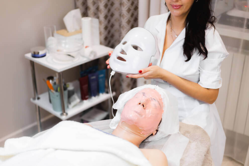 Client undergoing professional LED light therapy treatment in a medspa for skin healing, glow, and overall skin improvement.